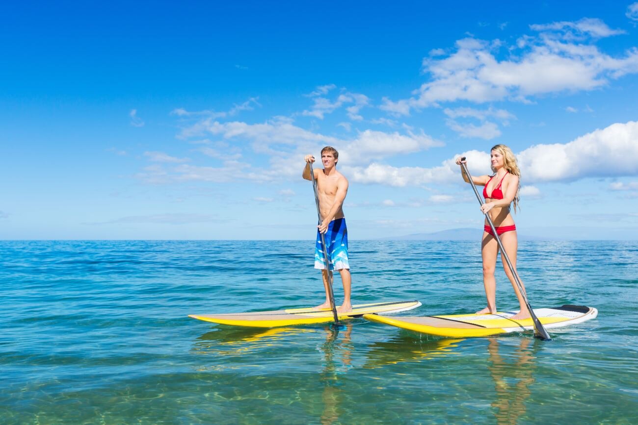 people kayaking on ocean in naples