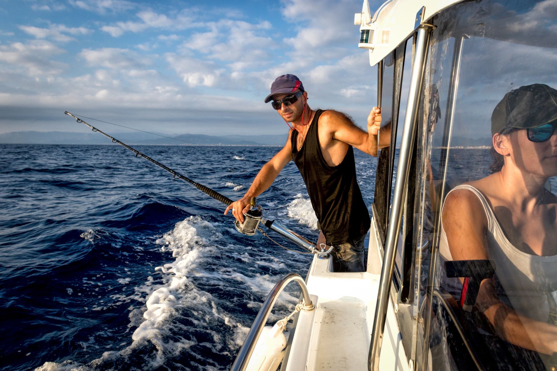 man fishing on a Naples fishing charter