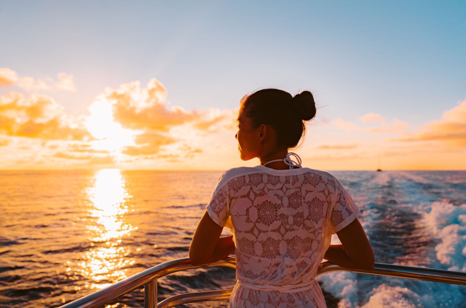 woman enjoying the view on a sunset cruise