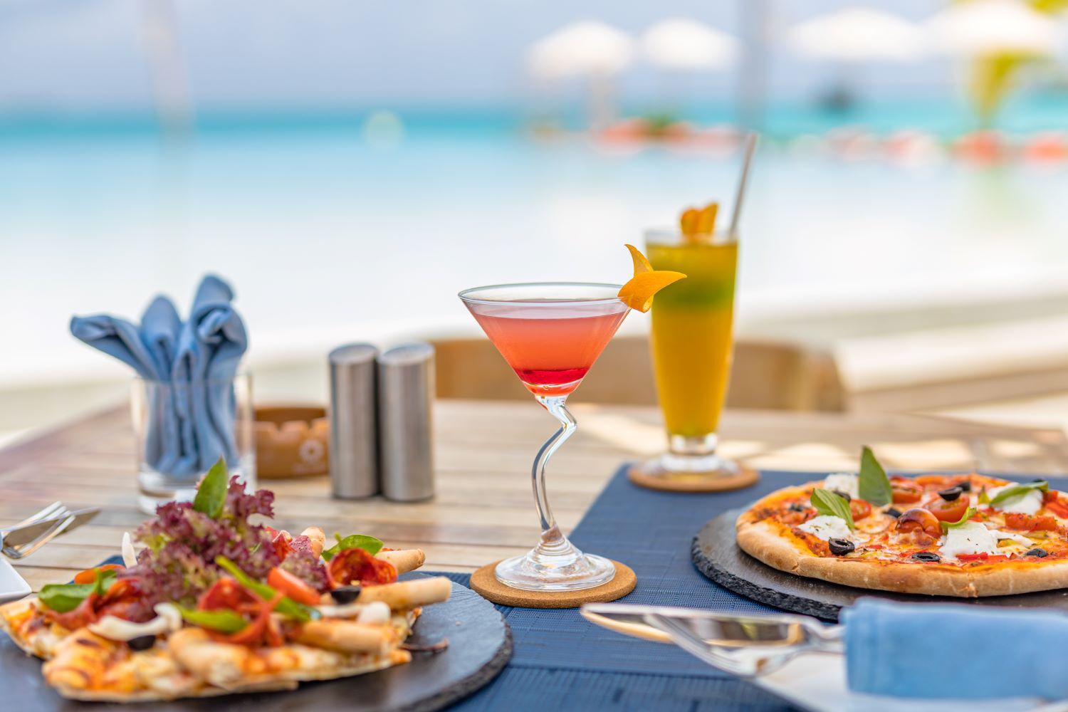 Cocktails and pizza at beachfront restaurant